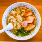 a bowl of soup with a spoon in it